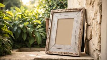 An empty frame sitting on a stone wall photo