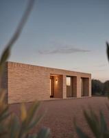 A brick house in the desert with a small window photo