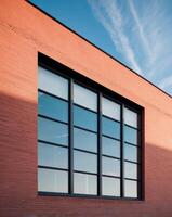 A large window with a blue sky in the background photo