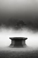 A black and white photo of a fountain in the fog