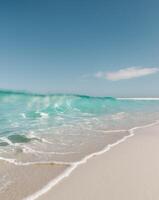 A beach with waves and a blue sky photo