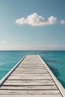 A wooden dock leading to the ocean photo