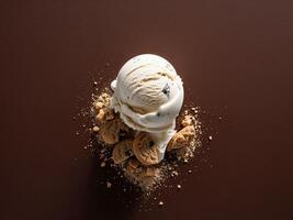 An ice cream cone with cookies and cream on top photo