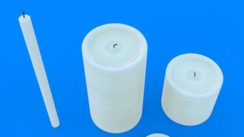 different size candle with blue background photo