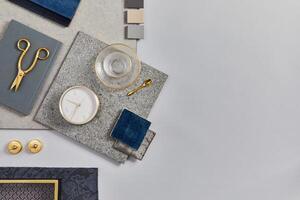 Creative flat lay design of stylish beige architect moodboard composition with samples of building, textile and natural materials and personal accessories. Top view, white background, template. photo