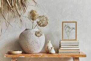 Stylish composition of living room interior with copy space, bench in retro style, clay vases and crockery. Rustic inspiration. Summer vibes. Beige wall. Template. photo