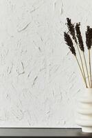 Stylish interior design composition of creative minimalisitc room with structure painting as copy space and personal accesories. Black and white. photo