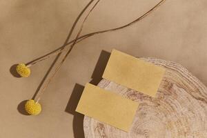 Stylish flat lay composition with mock up visit cards, wood, natural materials, dry plants and personal accessories. Neutral colors, top view, template. photo