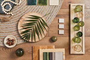 Flat lay of creative architect moodboard composition with samples of building, orange textile and natural materials and personal accessories. Top view, template. photo