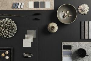 Flat lay composition of creative black architect moodboard with samples of building, textile and natural materials and personal accessories. Top view, black backgroung, template. photo