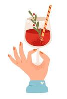 A hand holds a glass with a festive drink decorated with a twig and a straw. Glass of wine in hand. Flat illustration vector