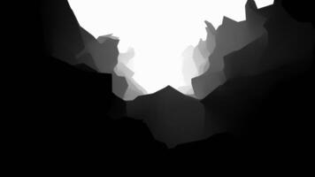 A black and white image of a cave with a light coming out of it video