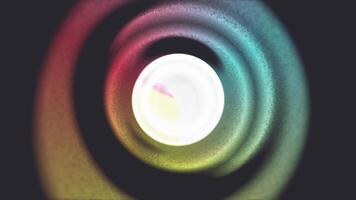 A colorful light is shown in a circular shape video