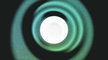 A green circular object with a white light in the center video