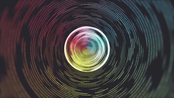 A colorful circular object in a black background video