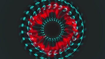 A red and blue circular pattern on a black background video