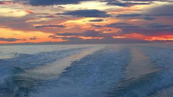 View of sea waves pattern behind the sightseeing ship in the early morning with colorful sky, Iceland. video