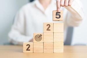 2025 year block with dartboard icon. Goal, Target, Resolution, strategy, plan, Action, mission, motivation, and New Year start concepts photo
