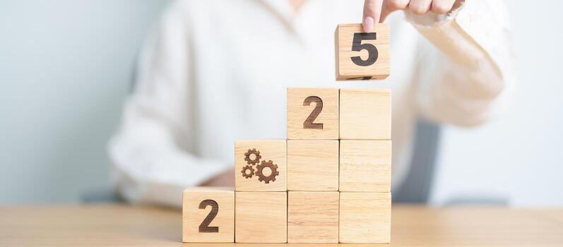 2025 year block with gear icon. Business Process, Team, teamwork, Goal, Target, Resolution, strategy, plan, Action, motivation, change, brainstorm and New Year start concepts photo