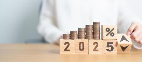 2024 to 2025 New year with percentage change to UP and Down arrow with coin stack. Interest rate, GDP, stocks market, financial, deflation and Inflation, mortgage, debt, Loan and Economic Recession photo