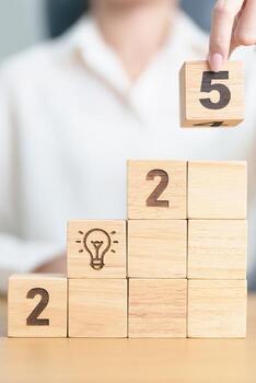 2025 year block with lightbulb. Business Idea, Creative, Thinking, brainstorm, Goal, Resolution, strategy, plan, Action, change and New Year start concepts photo