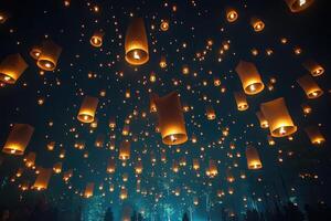 Hundreds of lanterns floating in the night sky creating a magical atmosphere photo