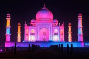 Taj mahal illuminated with vibrant colors at night in india photo