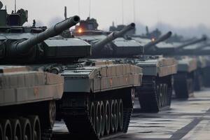 Modern tanks standing in line displaying military power photo
