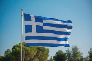 Greek flag waving in the wind on a sunny day photo
