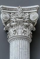 White marble ionic column standing tall against dark background photo