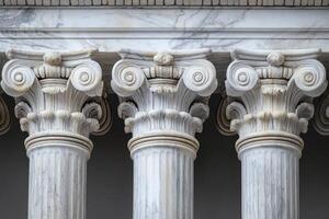 Row of ionic columns supporting marble entablature photo