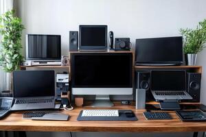 Modern home workstation featuring multiple laptops, computer, and screens showcasing a productive workspace photo