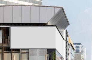 Mock up white corner LED display billboard on building. Clipping path for mockup photo