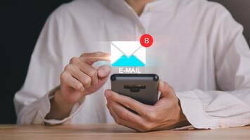 man reading electronic mail ,Email marketing and newsletter concept,Digital communication with email messages,Sending and receiving messages online with the email icon ,notifications photo