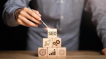 Marketer showing SEO concept ,optimization analysis tools , search engine rankings , social media sites based on results analysis data ,Website Search Optimization ,online marketing strategy photo
