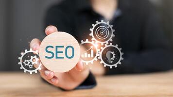 Marketer showing SEO concept ,optimization analysis tools , search engine rankings , social media sites based on results analysis data ,Website Search Optimization ,online marketing strategy photo
