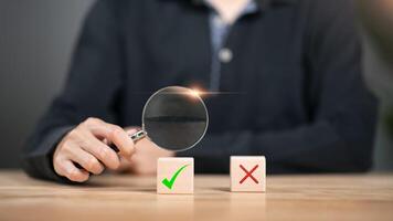 concept of checking and marking to select the right one ,Business Agreements and Approvals ,business contract signing ,Confirmation of contract documents or warranty card ,employment project review photo