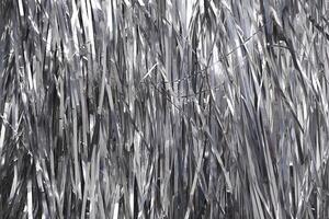 Shiny metallic strips creating reflective background texture. photo