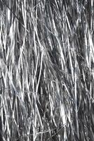 Shiny metallic strips creating reflective background texture. photo