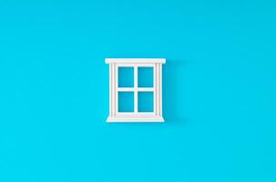 White window frame on light blue background. Minimal concept and simplicity. Flat lay. photo