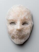 Intricate white mask with delicate patterns photo