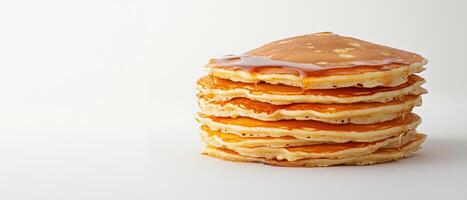 Delicious stack of golden pancakes drizzled with syrup photo