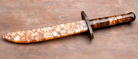Decorative dagger with amber colored handle photo