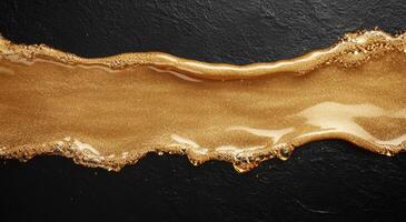 golden liquid flow on dark background photo
