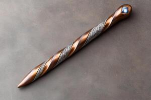 Copper colored drill bit with intricate patterns photo