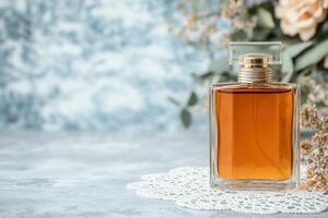 Elegant perfume bottle on lace doily with floral background photo