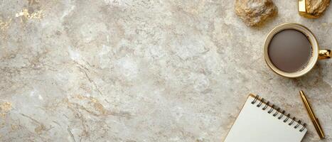 elegant marble desk with coffee and notebook photo