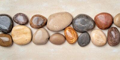 Assortment of smooth river rocks and pebbles photo
