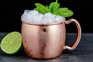 Refreshing copper mug cocktail with ice and mint leaves photo