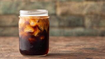 Refreshing iced coffee drink in a glass jar photo